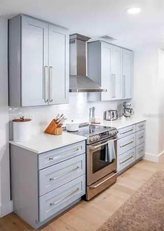 a kitchen with a faucet a sink and a window