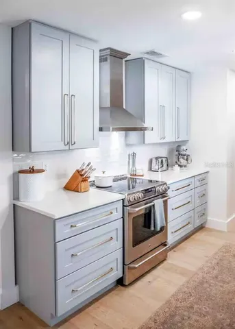 a kitchen with a faucet a sink and a window