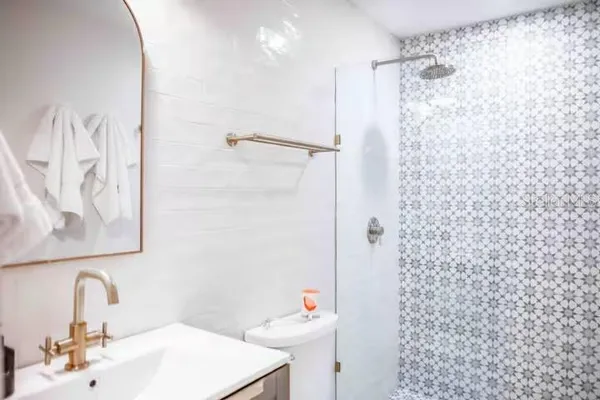 a bathroom with a sink and mirror