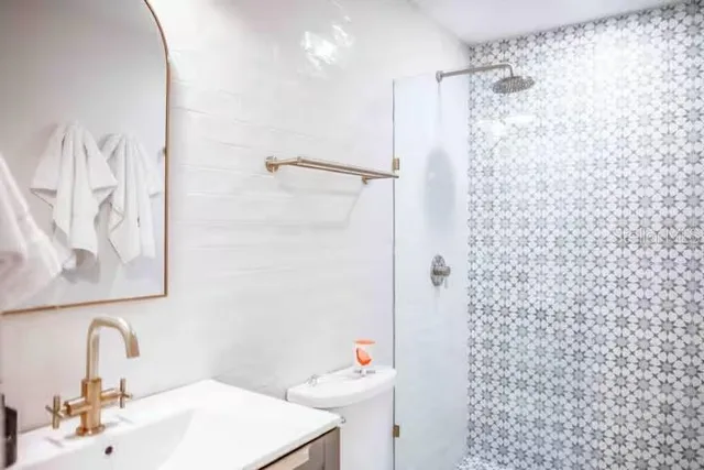 a bathroom with a sink and mirror