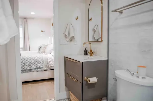 a living room with a bed furniture and a window