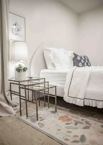 a kitchen with a faucet a sink and white cabinets