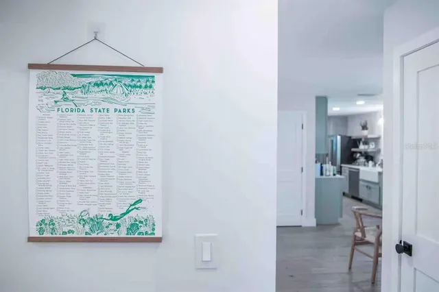 a vase of flowers sitting on a floor