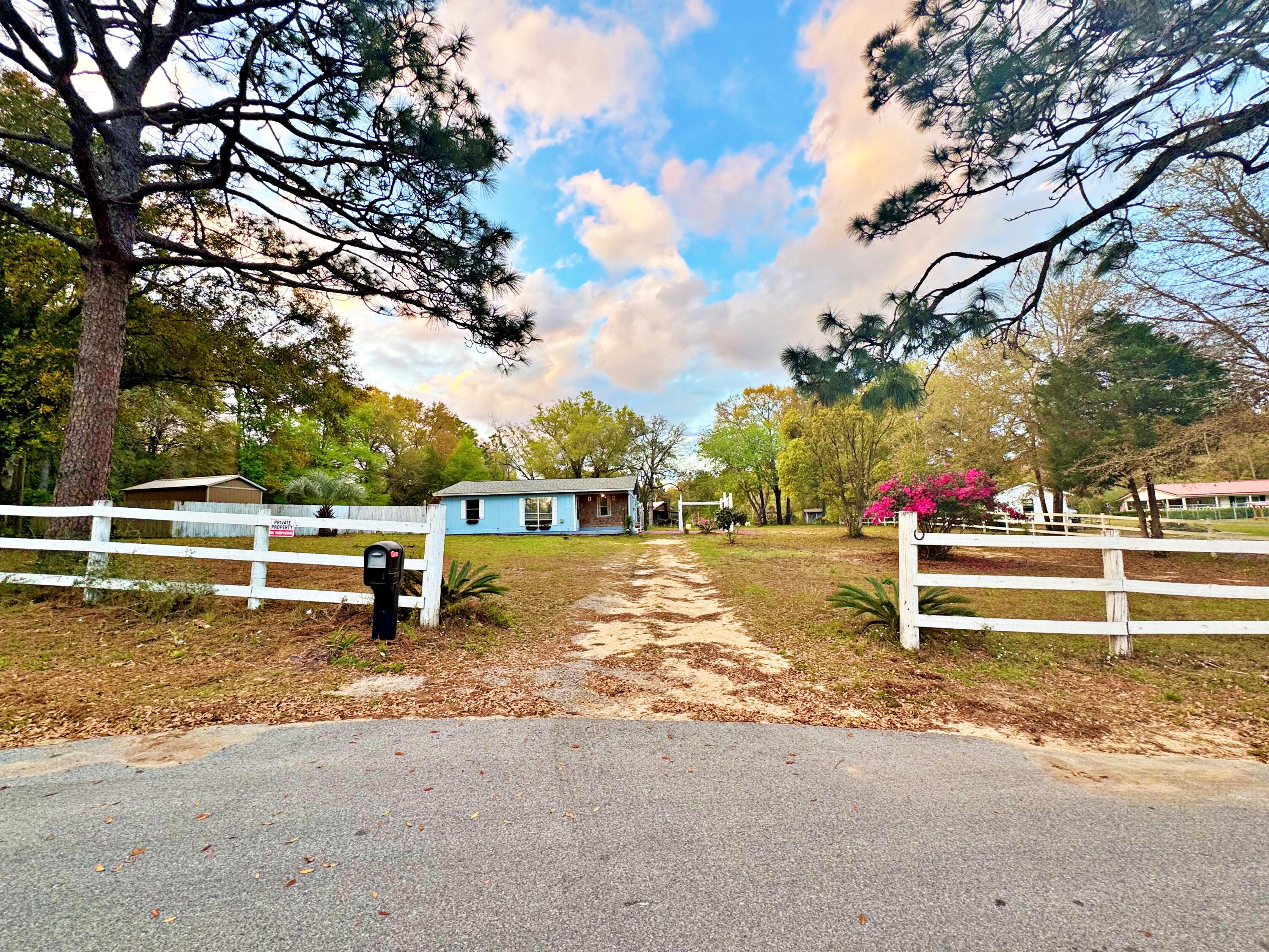 3183 Audrey Drive Crestview, FL 32539 - Photo 1 of 14 a view of street with trees in the background