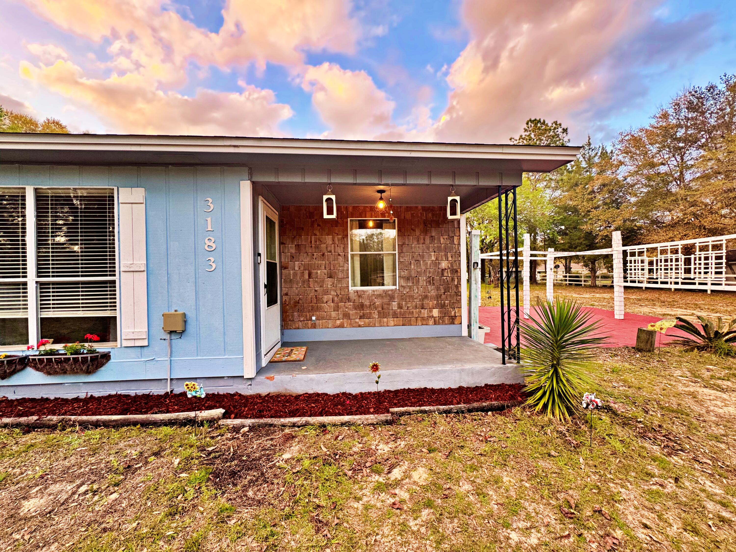 3183 Audrey Drive Crestview, FL 32539 - Photo 2 of 14 a view of a house with backyard sitting area and tub