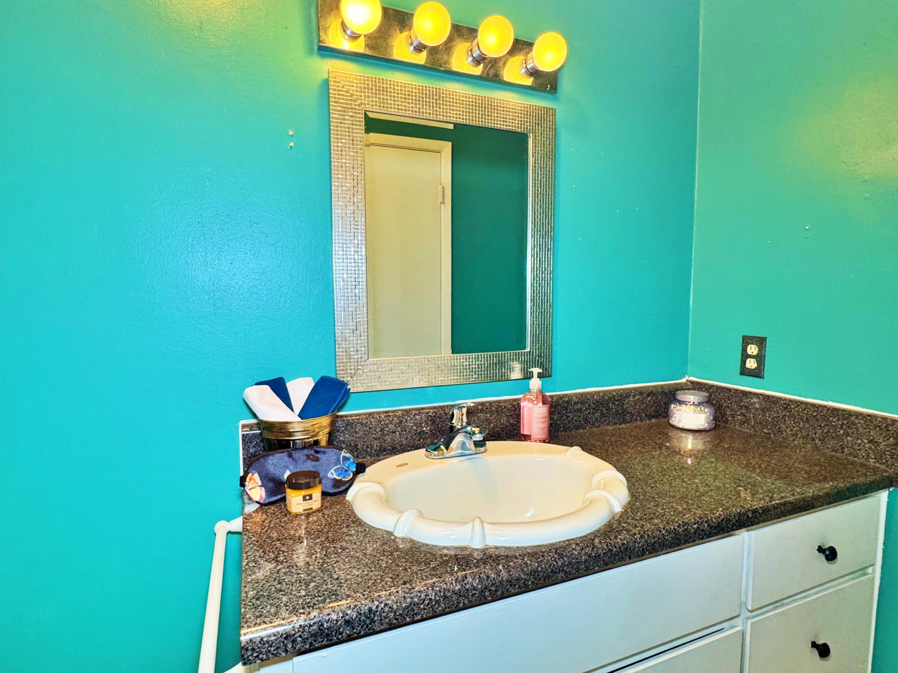 3183 Audrey Drive Crestview, FL 32539 - Photo 7 of 14 a bathroom with a sink and a mirror