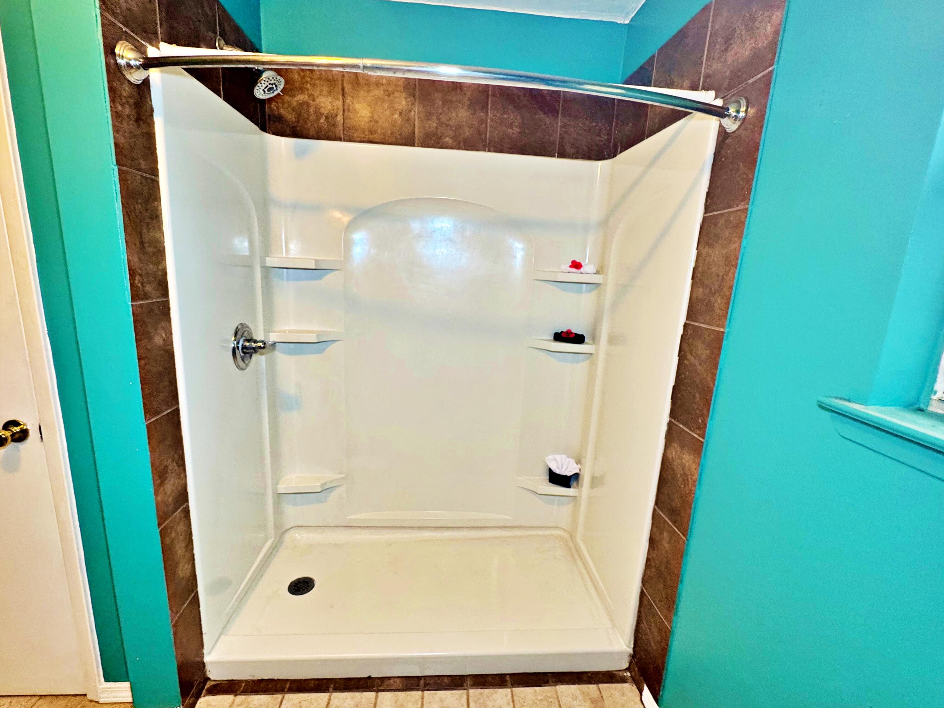 3183 Audrey Drive Crestview, FL 32539 - Photo 9 of 14 a bathroom with a shower