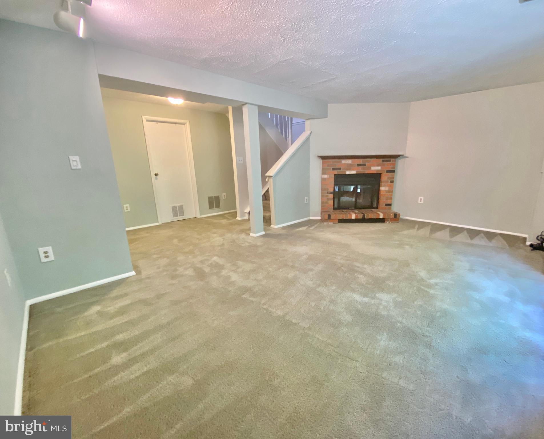 6212 Hillside Road Springfield, VA 22152 - Photo 29 of 36 Basement with wood burning fireplace
