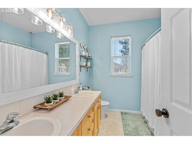 a view of a bathroom from the hallway