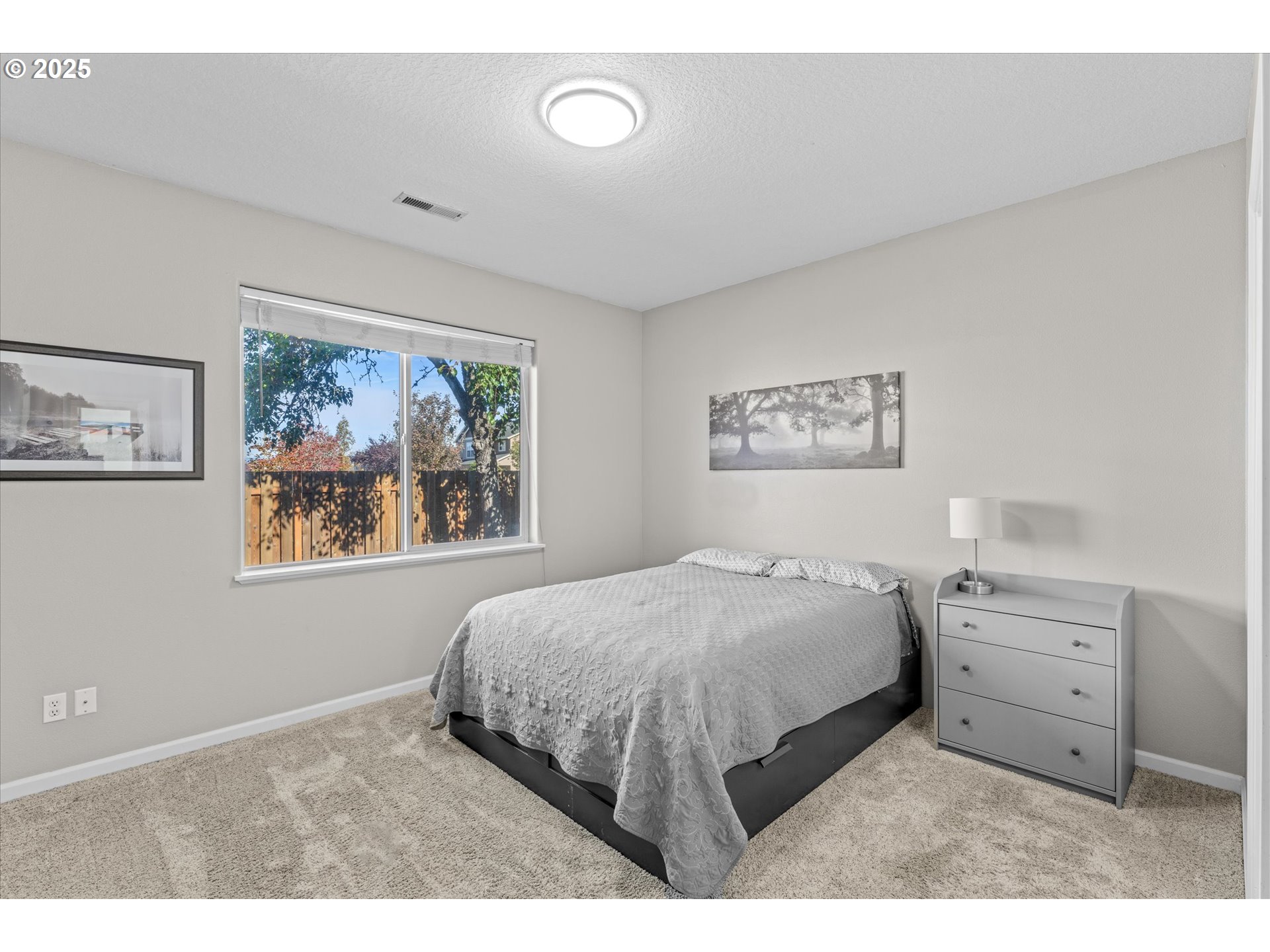 6475 Southeast 33rd Way Gresham, OR 97080 - Photo 29 of 47 a bedroom with a bed and a painting on the wall