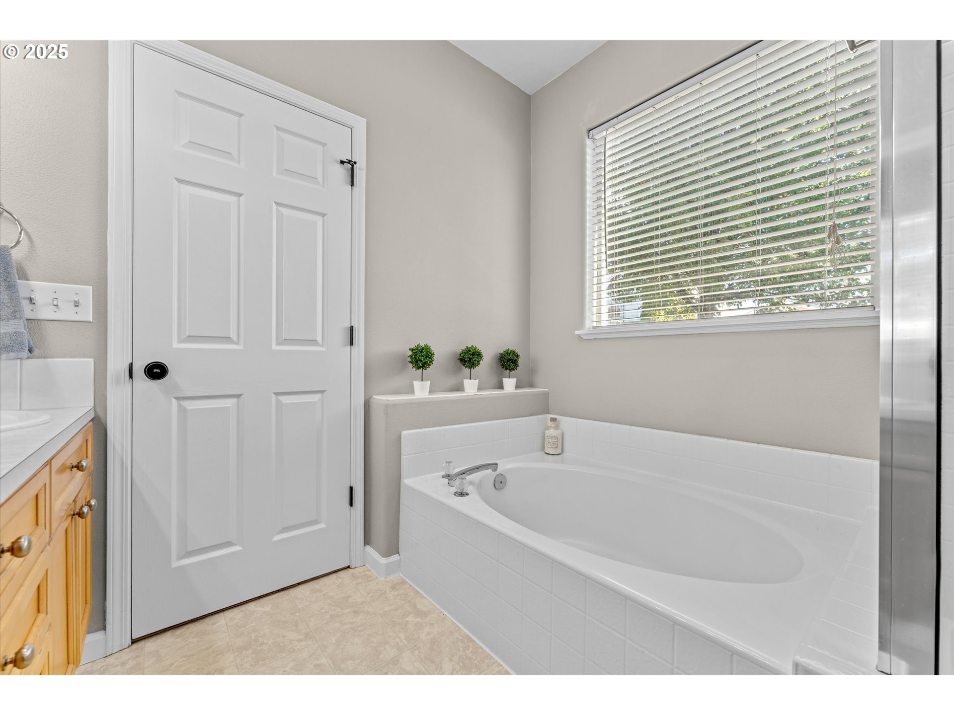 6475 Southeast 33rd Way Gresham, OR 97080 - Photo 32 of 47 a white bath tub sitting next to a window