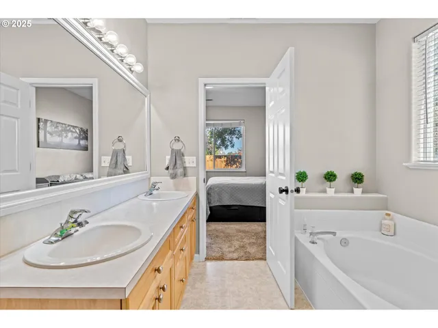 a view of a small space with wooden floor and a window