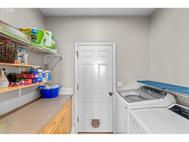 a view of backyard with wooden fence