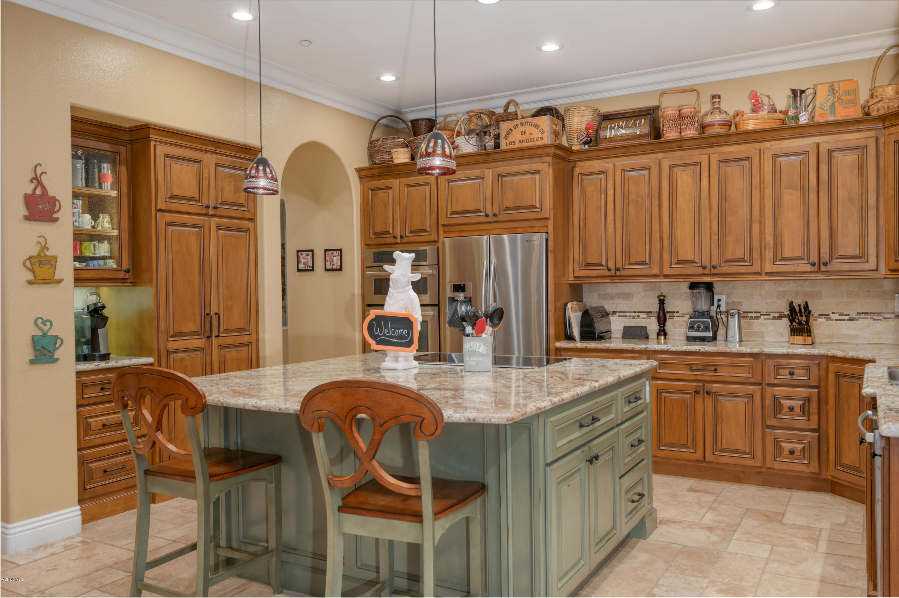 6945 Shadow Wood Drive Moorpark, CA 93021 - Photo 11 of 42 a kitchen with stainless steel appliances granite countertop a sink and a refrigerator
