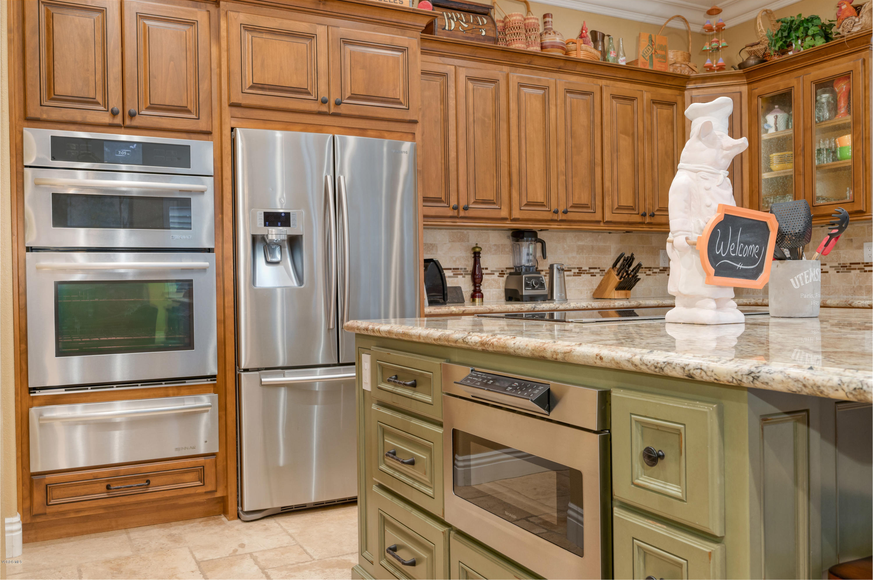 6945 Shadow Wood Drive Moorpark, CA 93021 - Photo 14 of 42 a kitchen with granite countertop stainless steel appliances and cabinets