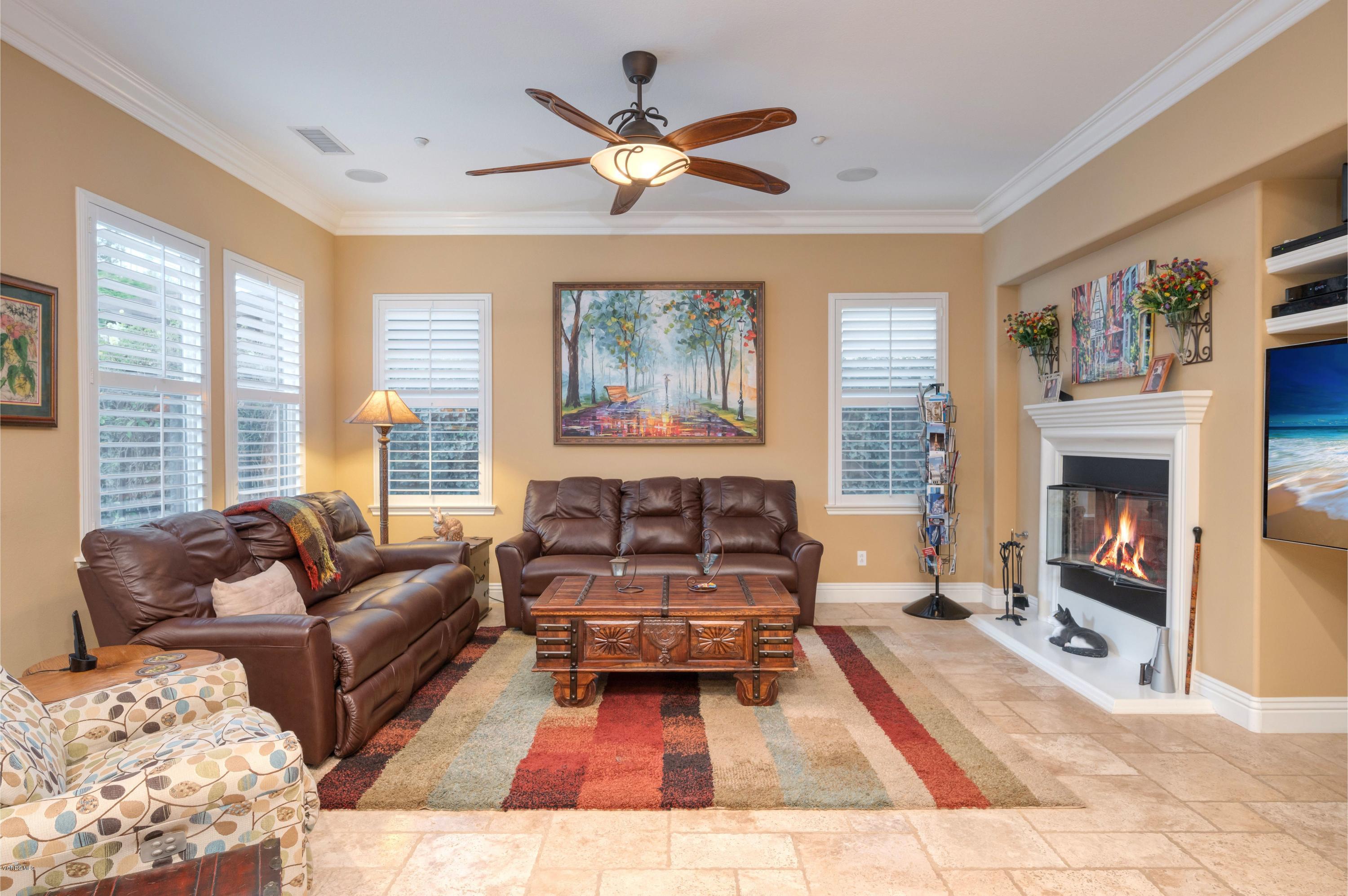 6945 Shadow Wood Drive Moorpark, CA 93021 - Photo 17 of 42 a living room with furniture and a fireplace