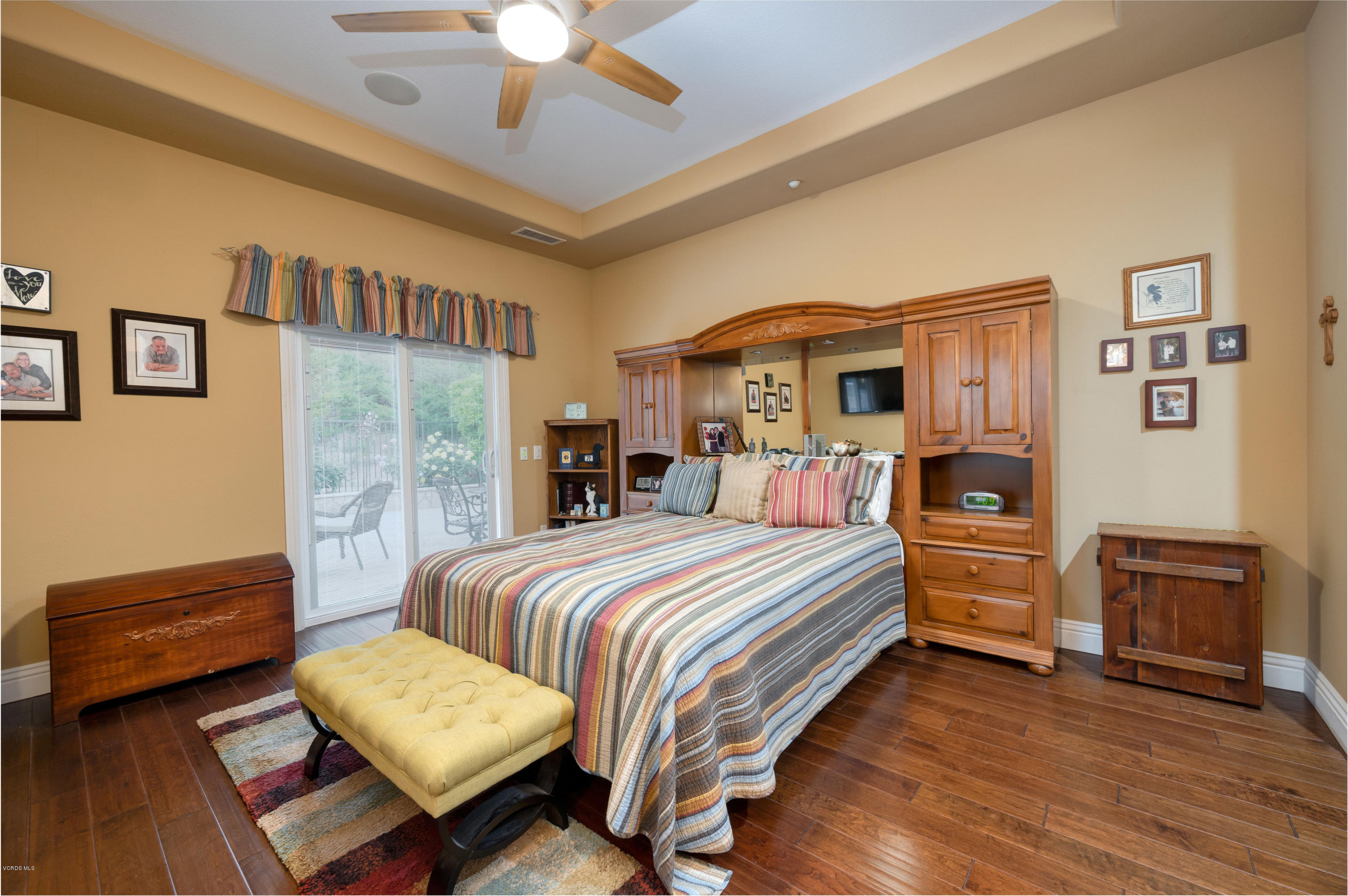 6945 Shadow Wood Drive Moorpark, CA 93021 - Photo 22 of 42 a bedroom with a bed and a chandelier