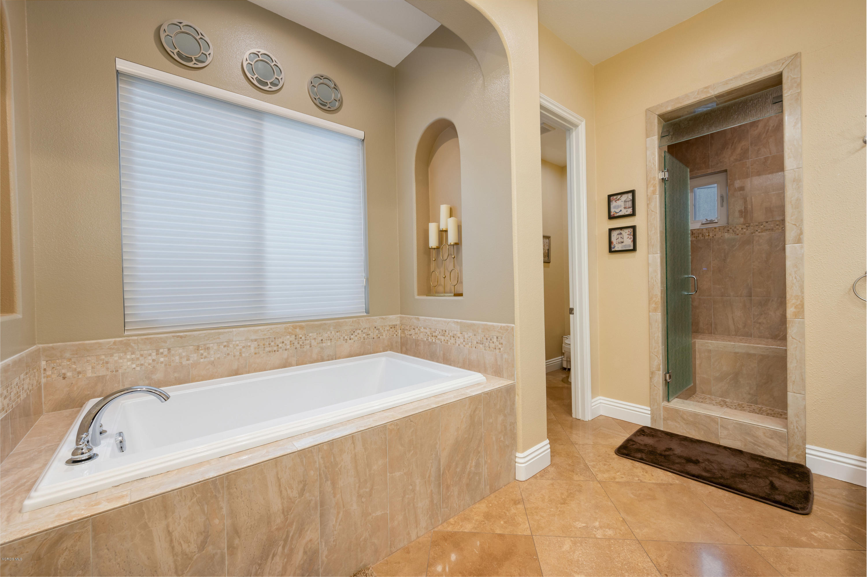 6945 Shadow Wood Drive Moorpark, CA 93021 - Photo 24 of 42 a spacious bathroom with a bathtub and shower