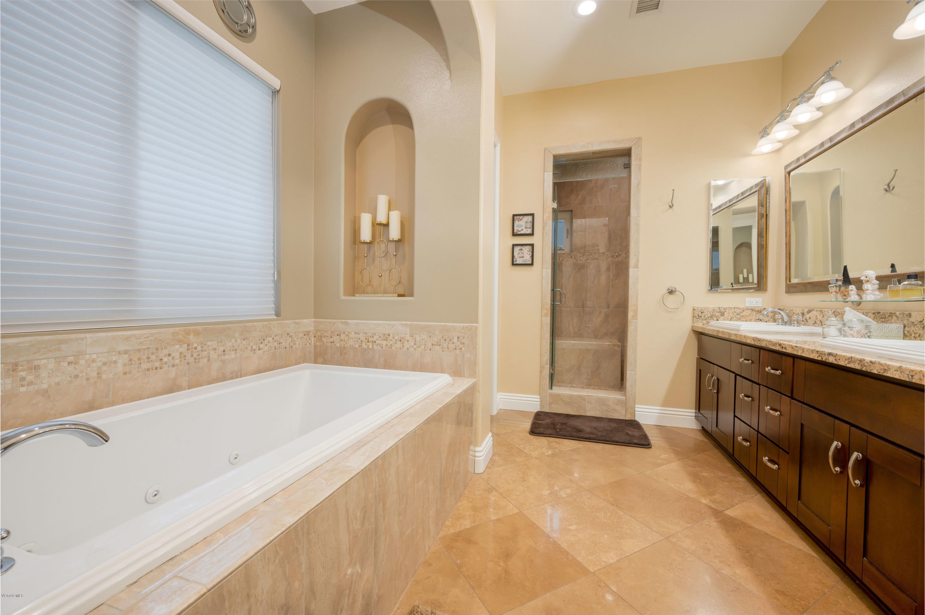 6945 Shadow Wood Drive Moorpark, CA 93021 - Photo 26 of 42 a spacious bathroom with a tub sink shower and mirror