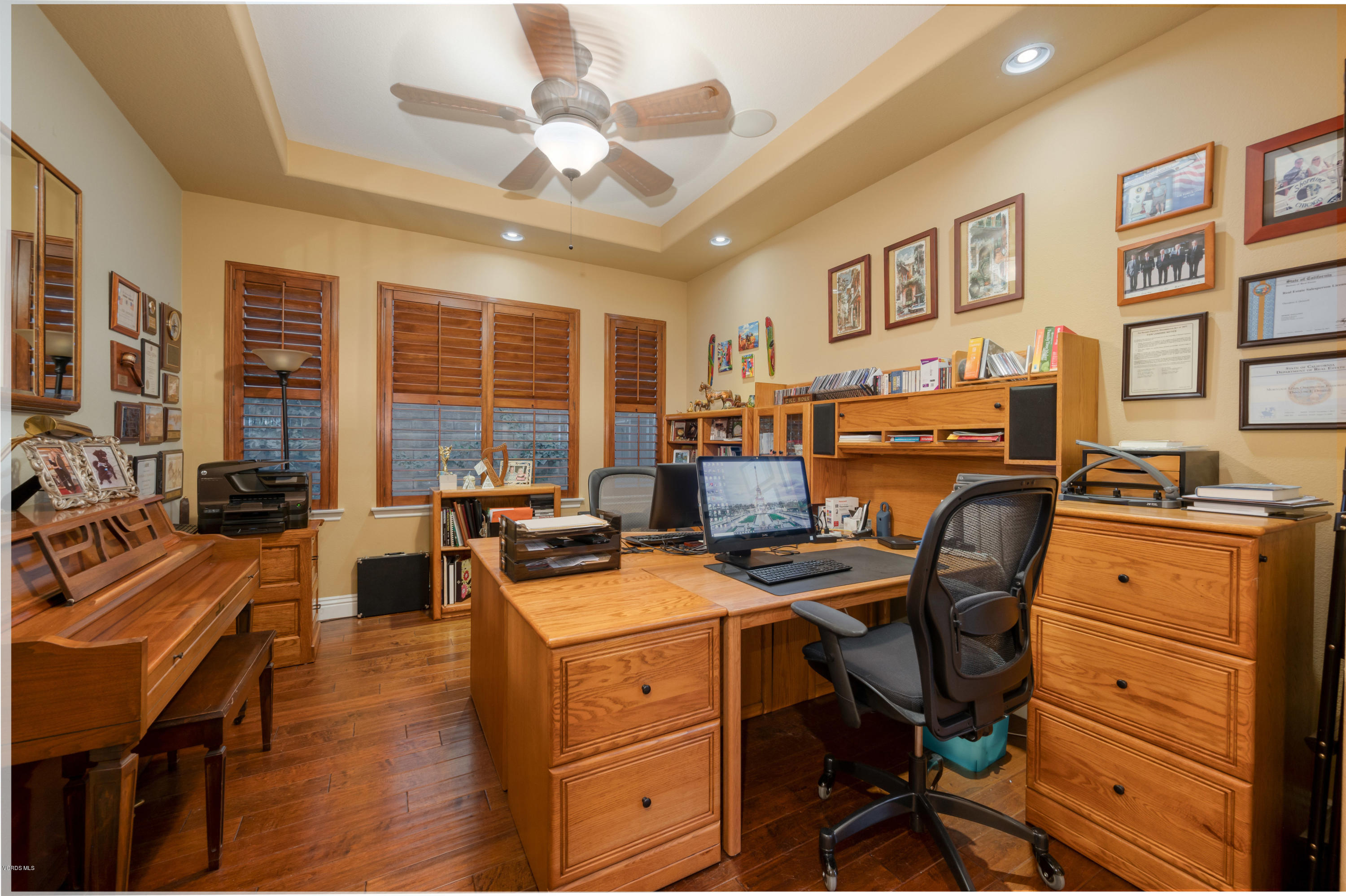 6945 Shadow Wood Drive Moorpark, CA 93021 - Photo 29 of 42 a view of a workspace with furniture and a livingroom