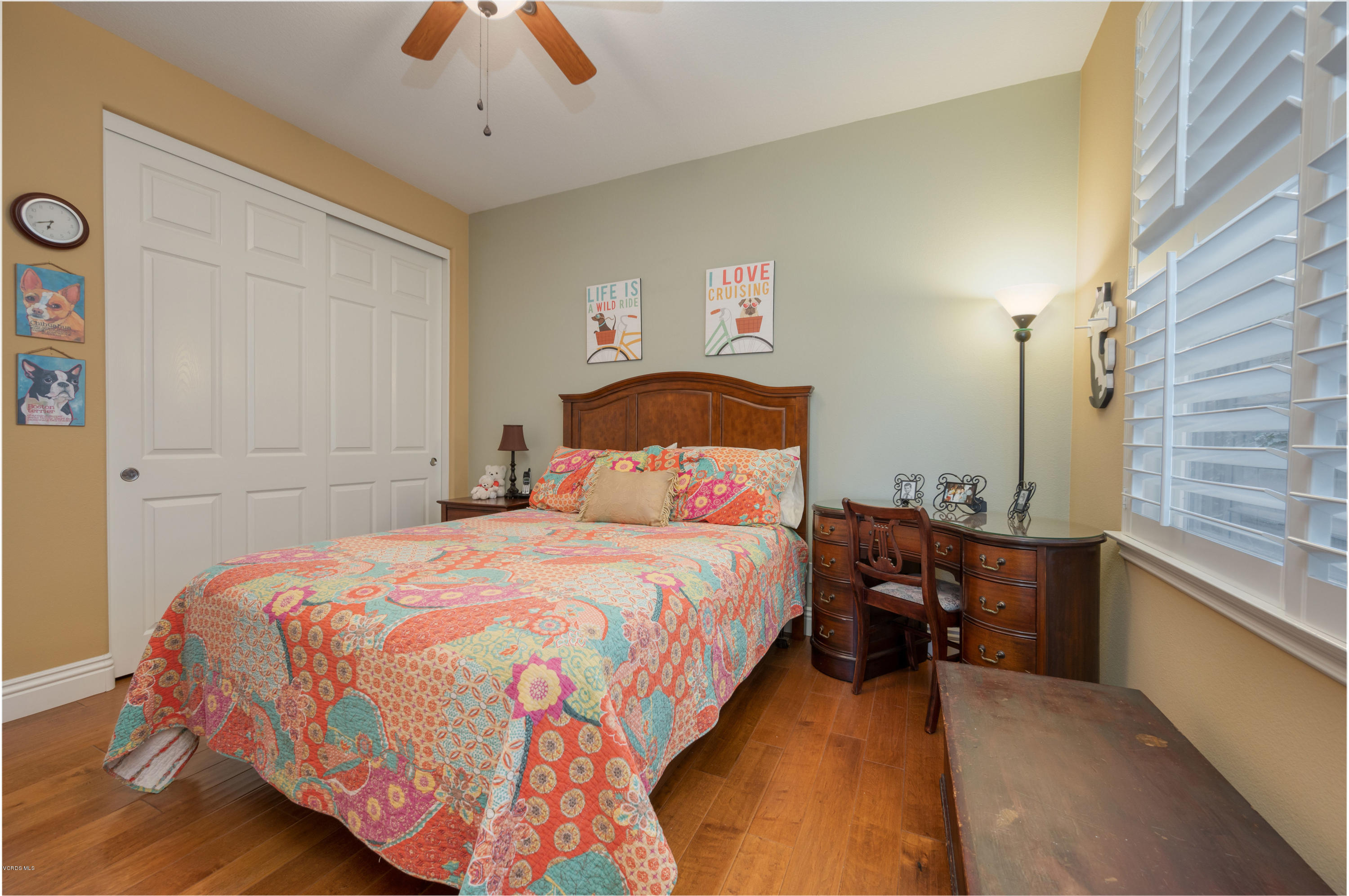 6945 Shadow Wood Drive Moorpark, CA 93021 - Photo 30 of 42 a bedroom with a bed and a chandelier