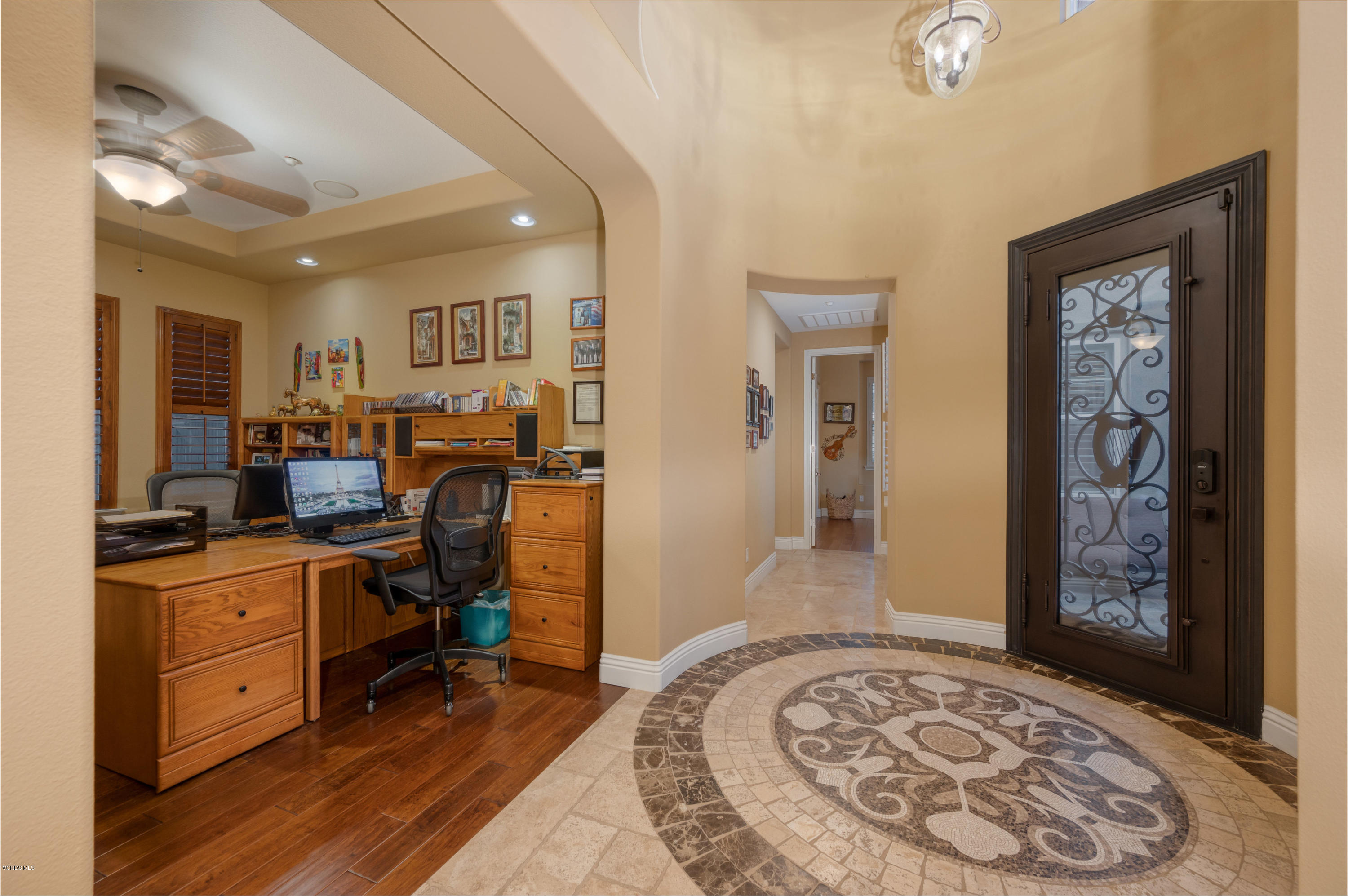 6945 Shadow Wood Drive Moorpark, CA 93021 - Photo 4 of 42 a view of a workspace with furniture and a window