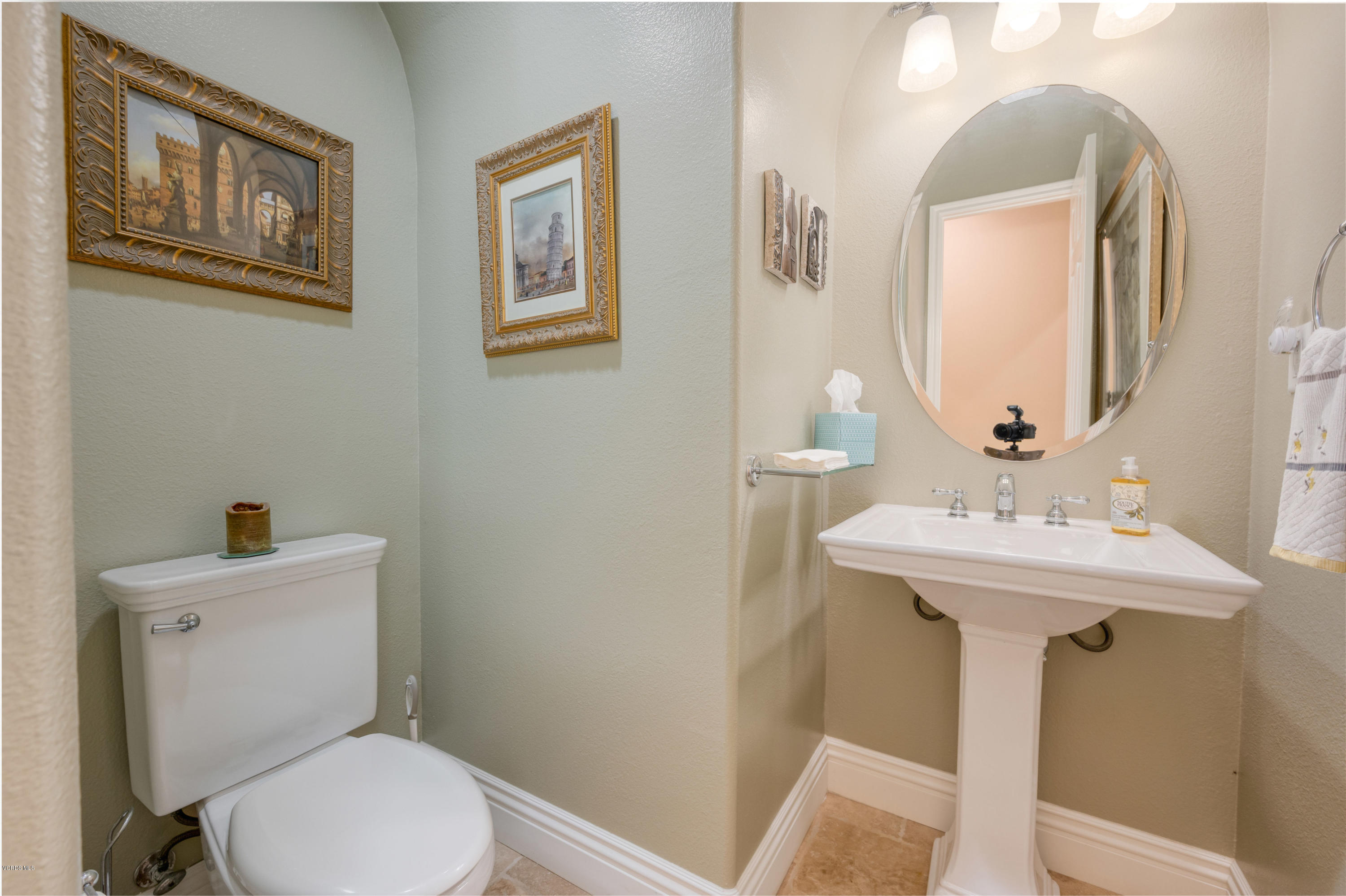 6945 Shadow Wood Drive Moorpark, CA 93021 - Photo 35 of 42 a bathroom with a sink mirror and toilet