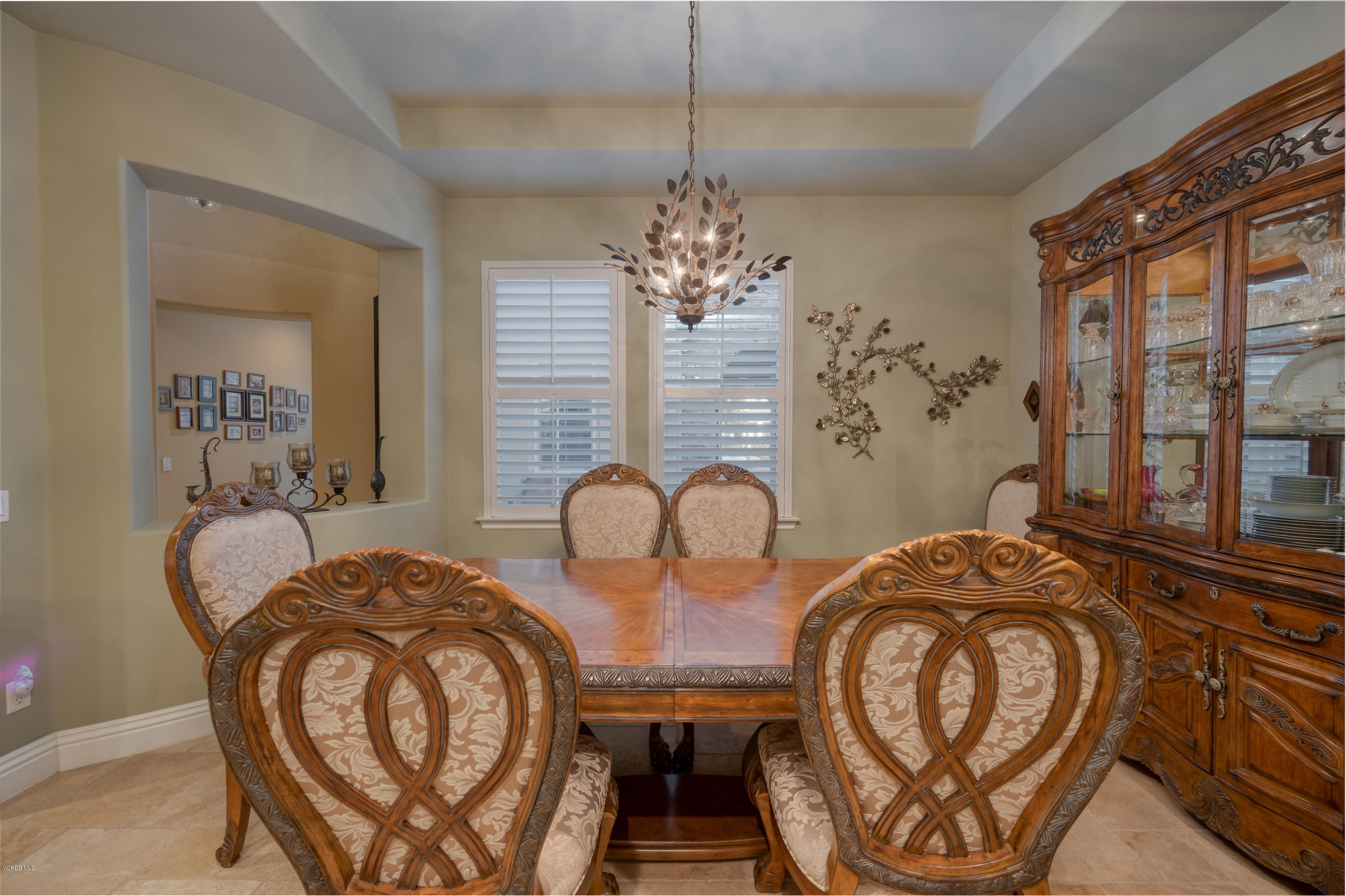 6945 Shadow Wood Drive Moorpark, CA 93021 - Photo 7 of 42 a dining room with furniture a chandelier and a rug