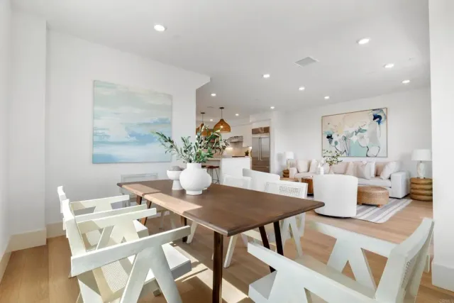 a bed room with bed and a potted plant