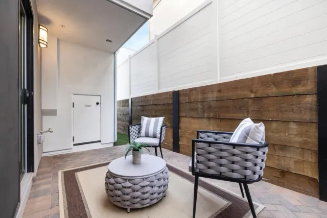 a front view of a house with large windows