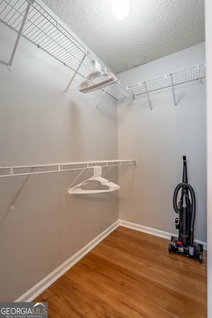 a view of a room with wooden floor