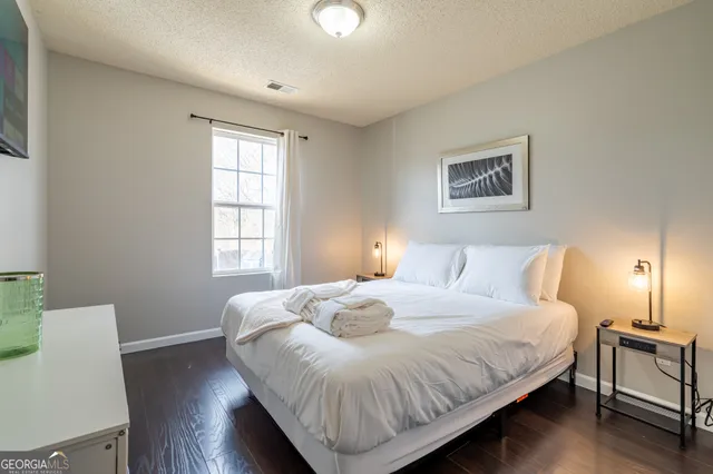 a bedroom with bed and a window