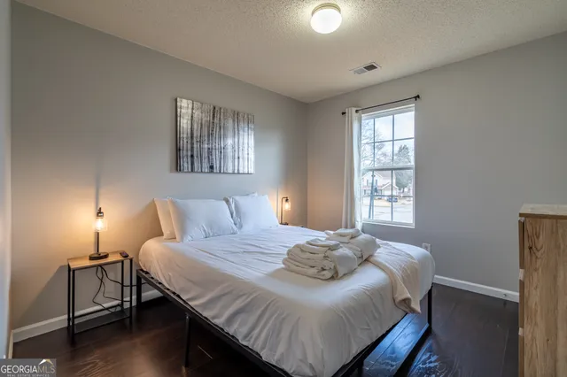 a bedroom with a bed and window