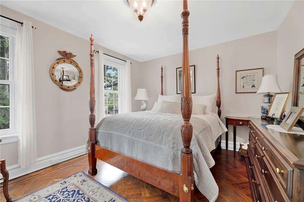 90 MacKay Place Brooklyn, NY 11209 - Photo 16 of 32 a bedroom with a bed and a window