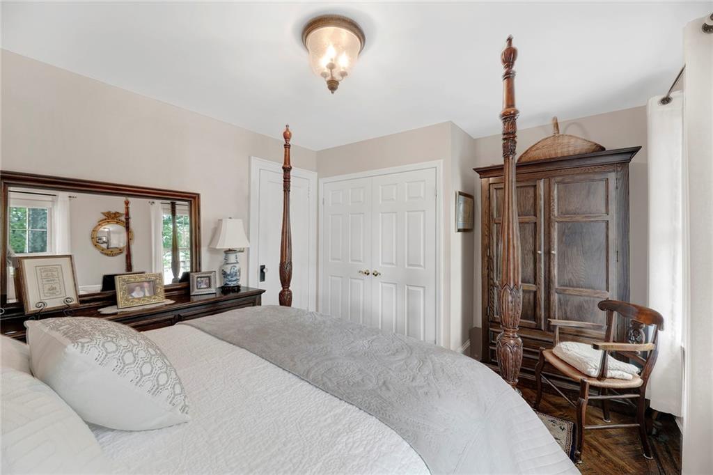 90 MacKay Place Brooklyn, NY 11209 - Photo 18 of 32 a bedroom with a bed large window and couch
