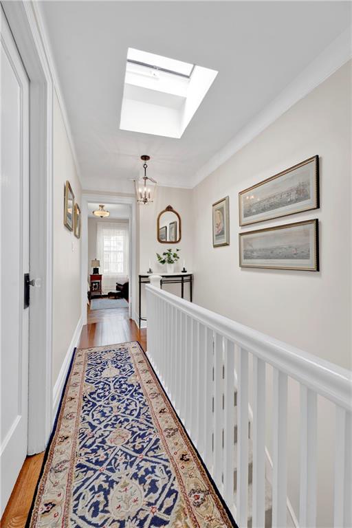 90 MacKay Place Brooklyn, NY 11209 - Photo 21 of 32 a view of a hallway with wooden floor and windows