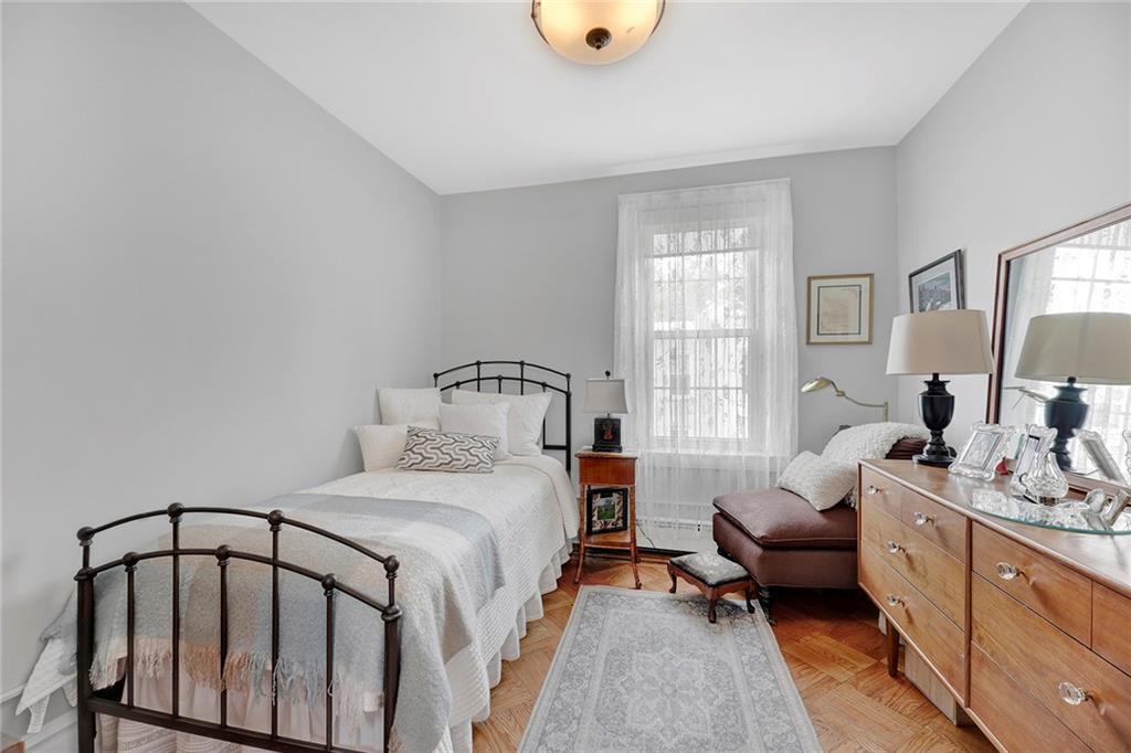 90 MacKay Place Brooklyn, NY 11209 - Photo 23 of 32 a bed room with a bed and a window