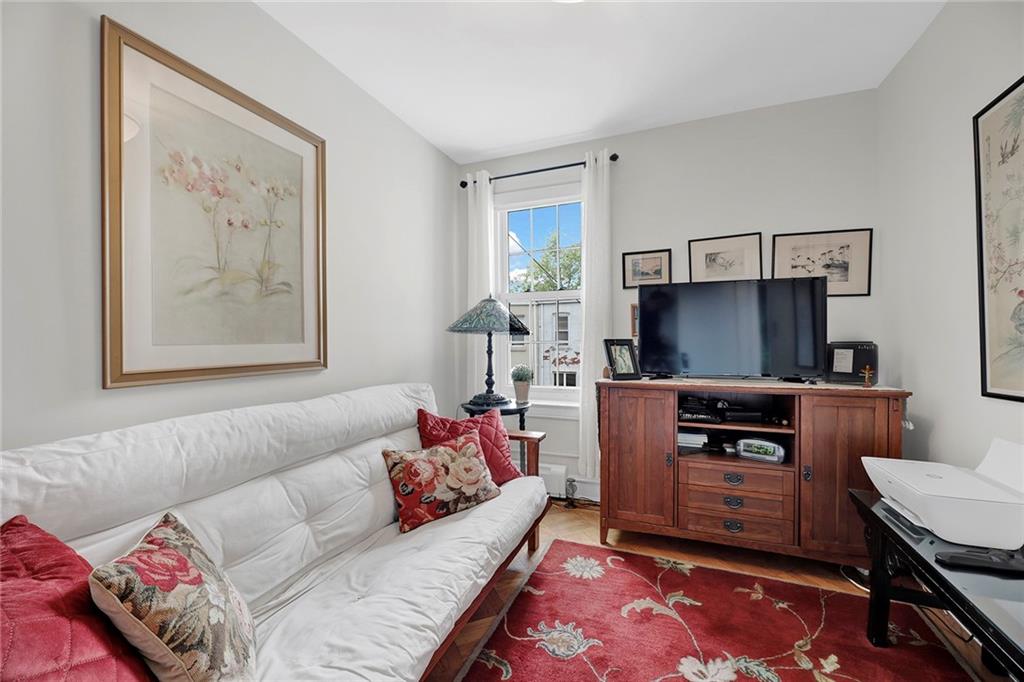 90 MacKay Place Brooklyn, NY 11209 - Photo 25 of 32 a living room with furniture and a flat screen tv