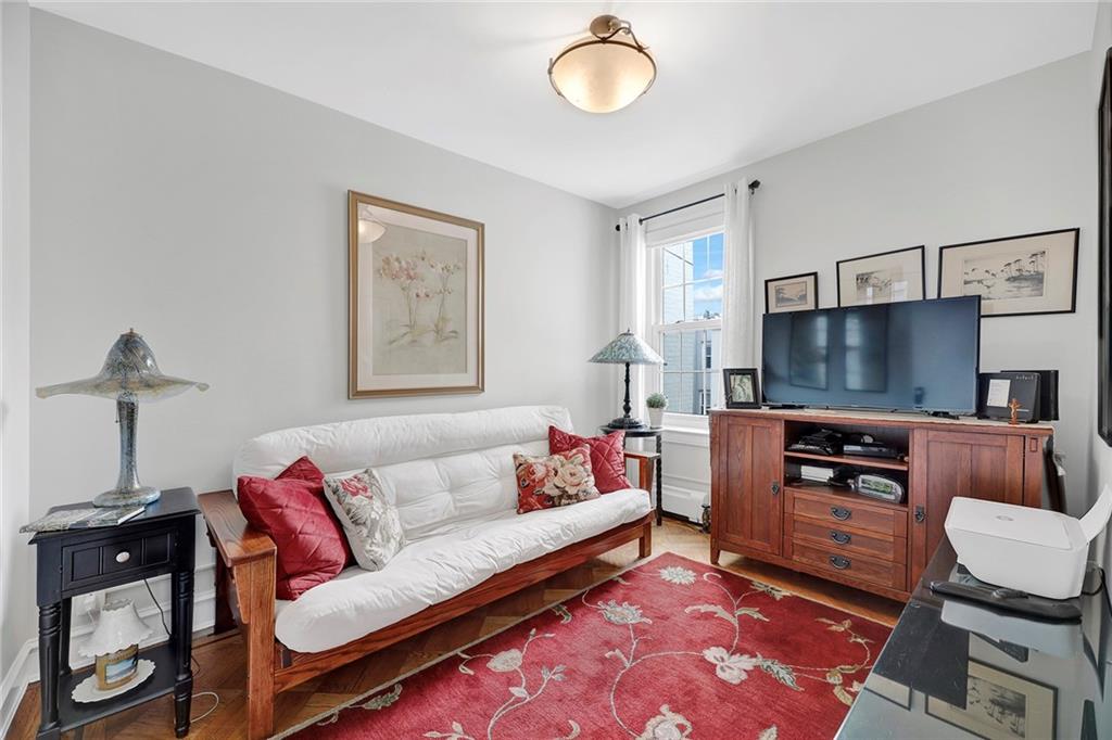 90 MacKay Place Brooklyn, NY 11209 - Photo 26 of 32 a living room with furniture and a flat screen tv