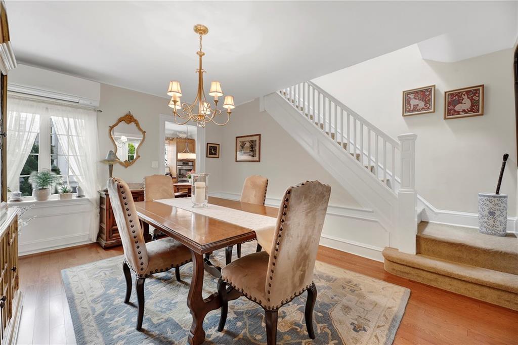 90 MacKay Place Brooklyn, NY 11209 - Photo 10 of 32 a view of a dining room with furniture window and wooden floor