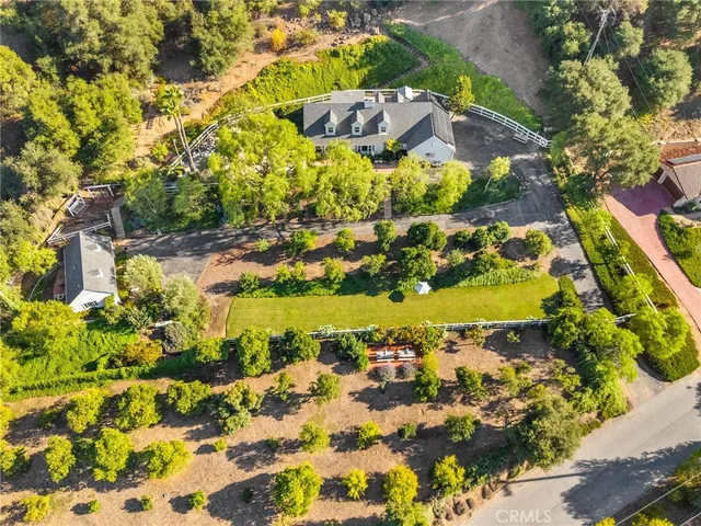 an aerial view of house with yard