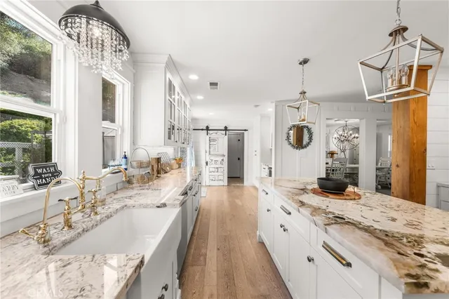 a view of a hallway with wooden shelves