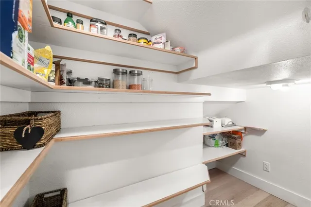 a bathroom with a sink a mirror and a shower