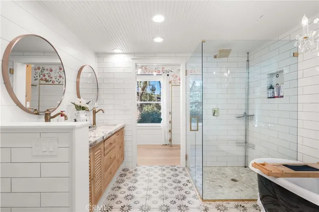 a bathroom with a sink a mirror and vanity