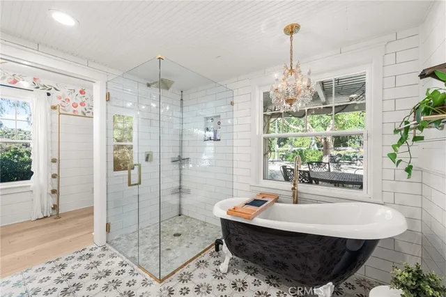 a view of backyard with outdoor seating and green space