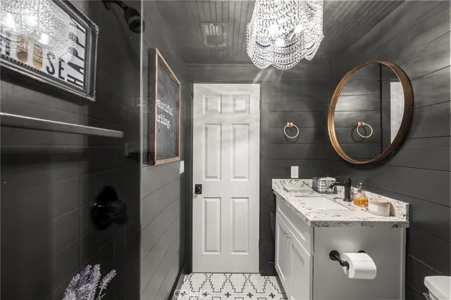 a living room with furniture a window and a chandelier