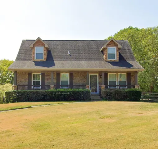 a front view of house with yard