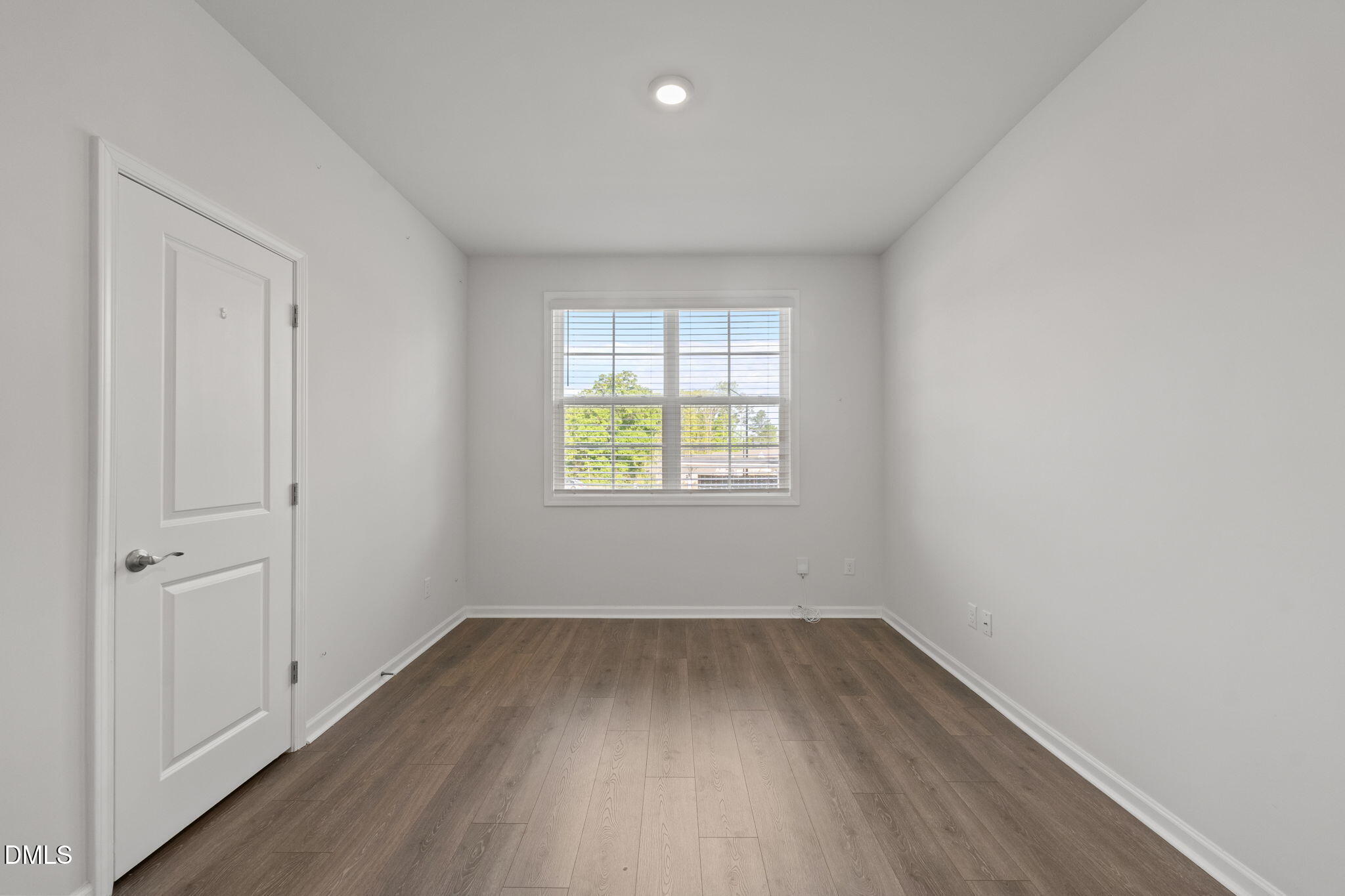 1639 Abberly Place Graham, NC 27253 - Photo 4 of 43 an empty room with wooden floor and windows