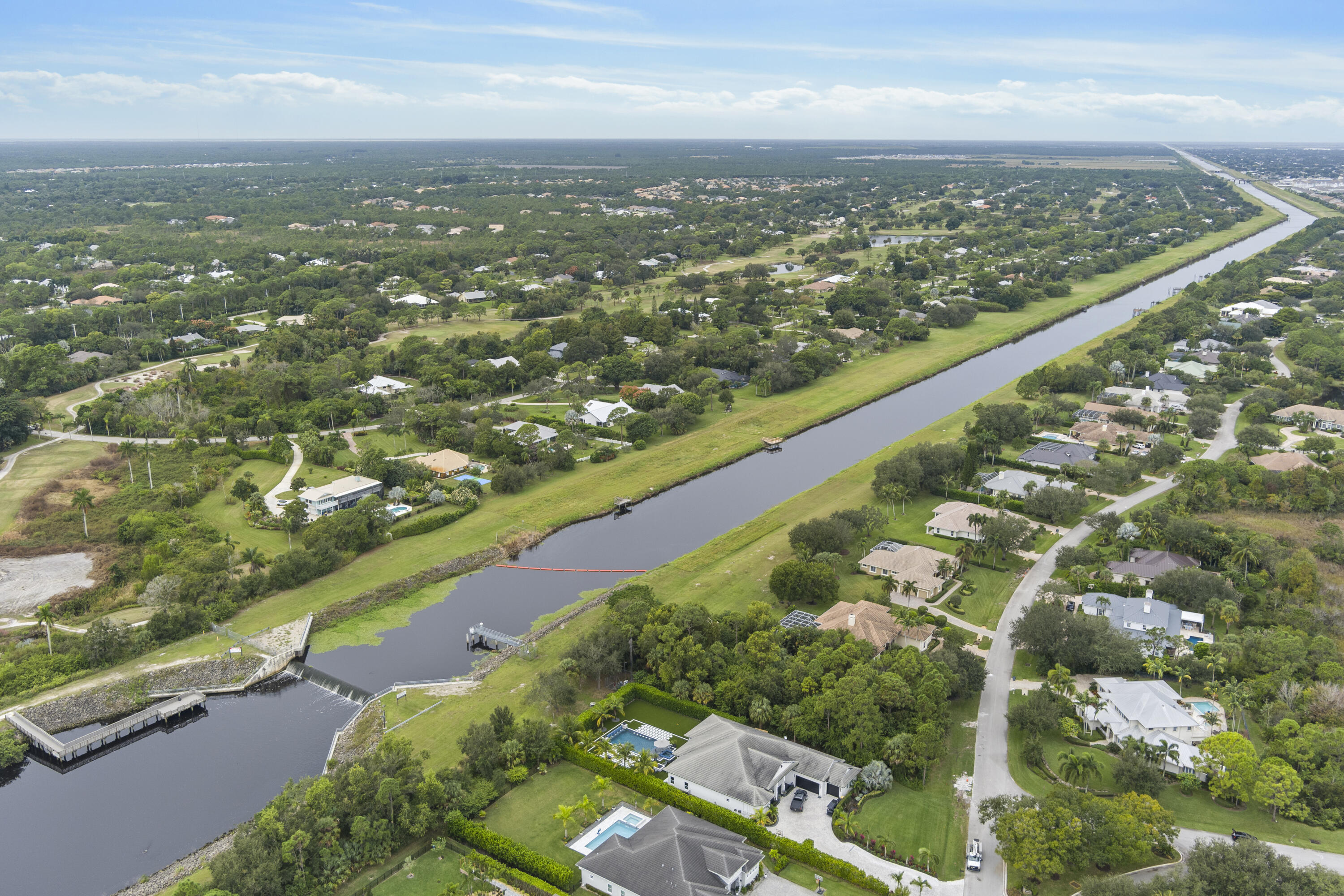 3544 Southwest Rivers End Way Palm City, FL 34990 - Photo 5 of 17 an aerial view of city and lake