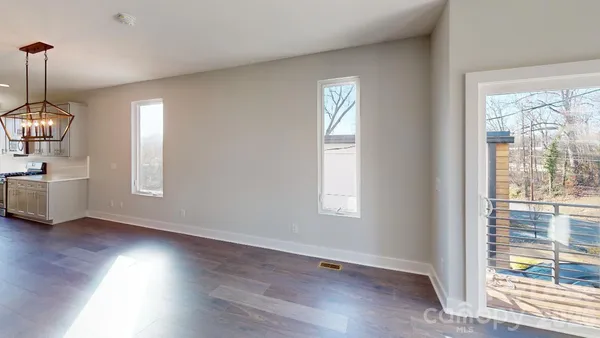 wooden floor in an empty room and a window